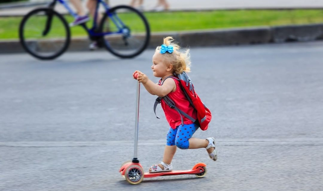 young girl riding scooter ProScootersMart
